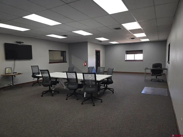 a view of a workspace with furniture