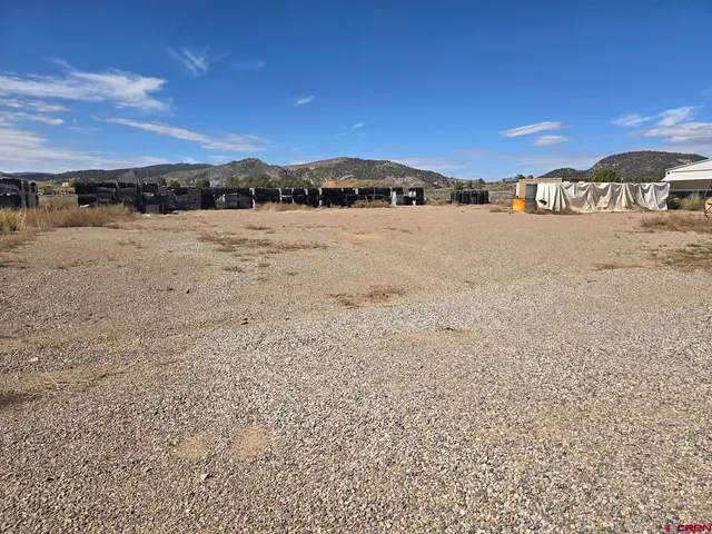 a view of terrace with lawn chairs