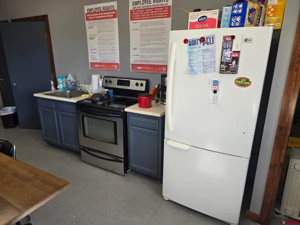 a white refrigerator freezer sitting inside of a kitchen