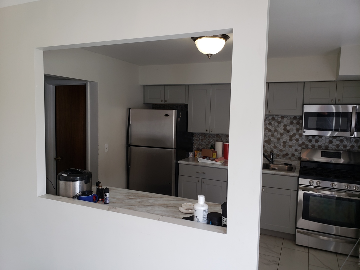 952 Virginia Lane Elmhurst, IL 60126 - Photo 9 of 11 a kitchen with a refrigerator and a stove