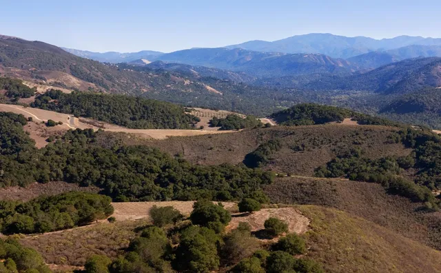 a aerial view of a house with a yard