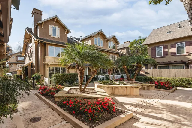 a view of multiple houses with a yard