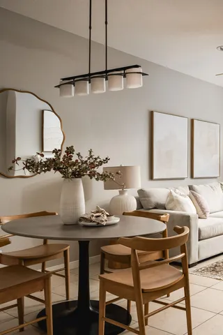 a kitchen with a table and chairs in it