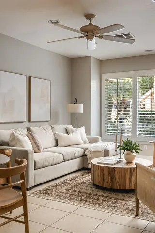 a living room with furniture and a large window