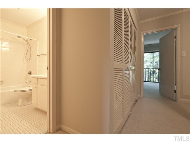 3080 Colony Road, Unit D Durham, NC 27705 - Photo 12 of 12 Additional full bath on the second level. Laundry area is in the hall behind the louvered doors.