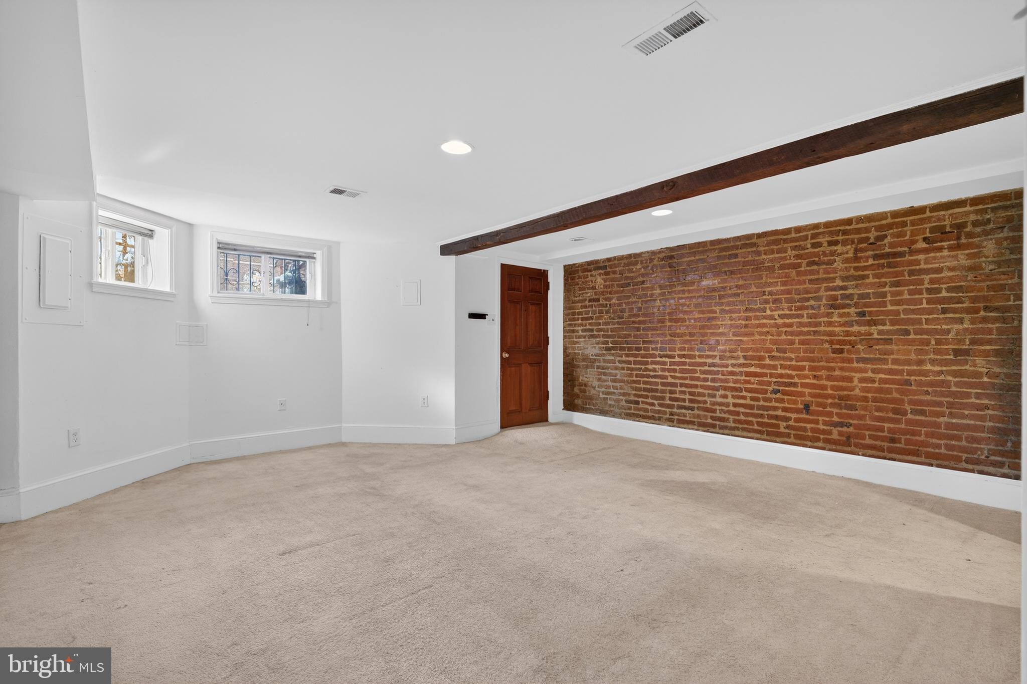 1351 Monroe Street Northwest Washington, DC 20010 - Photo 6 of 23 a view of an empty room with a window