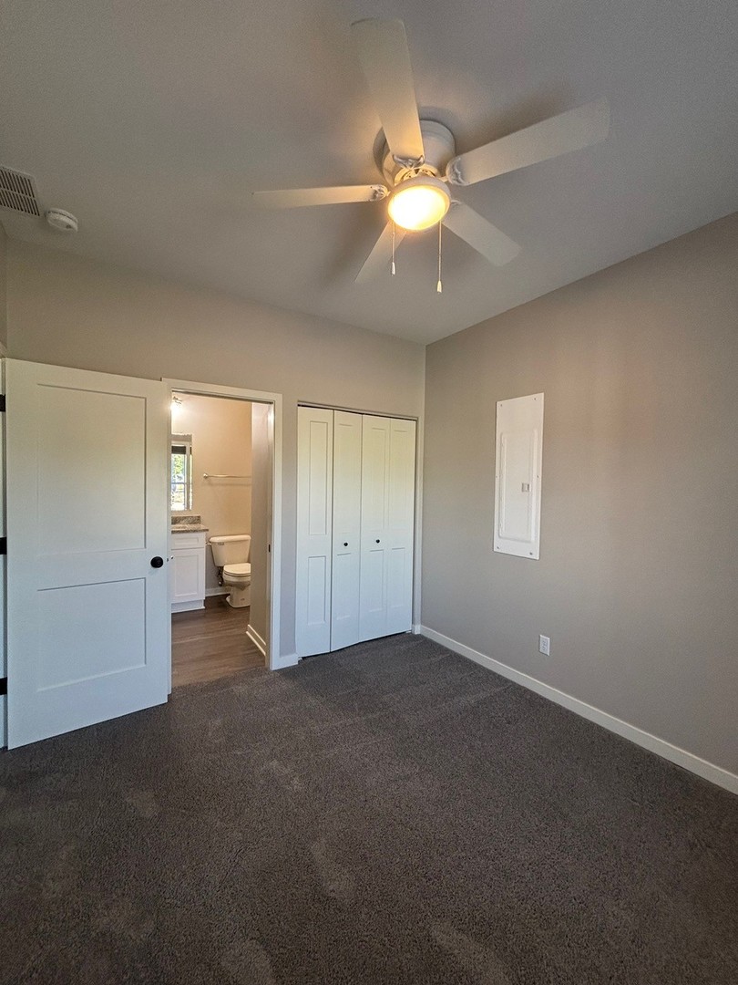 610 Anjali Court, Unit R Sycamore, IL 60178 - Photo 11 of 20 an empty room with fan and windows