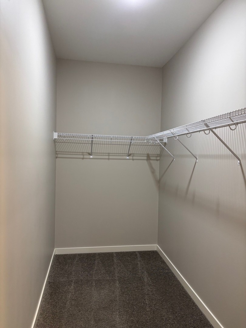 610 Anjali Court, Unit R Sycamore, IL 60178 - Photo 16 of 20 a view of a room with racks on the wall