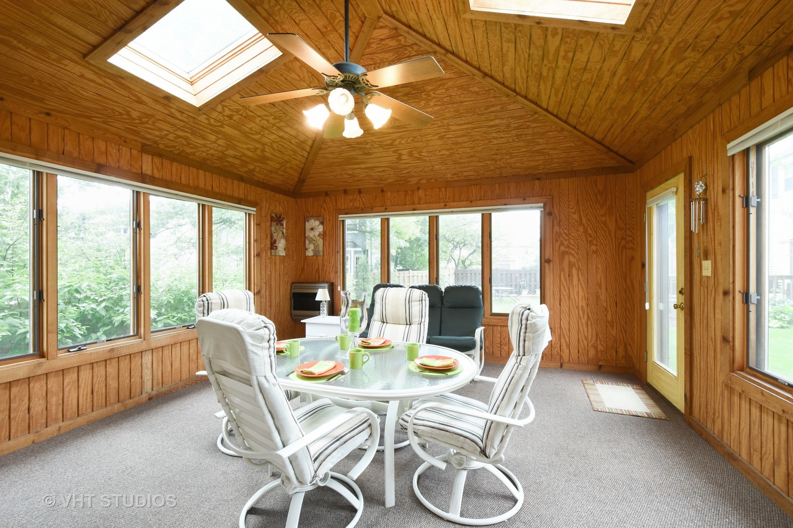1320 Devonshire Road Buffalo Grove, IL 60089 - Photo 11 of 25 a dining room with furniture a chandelier and outside view
