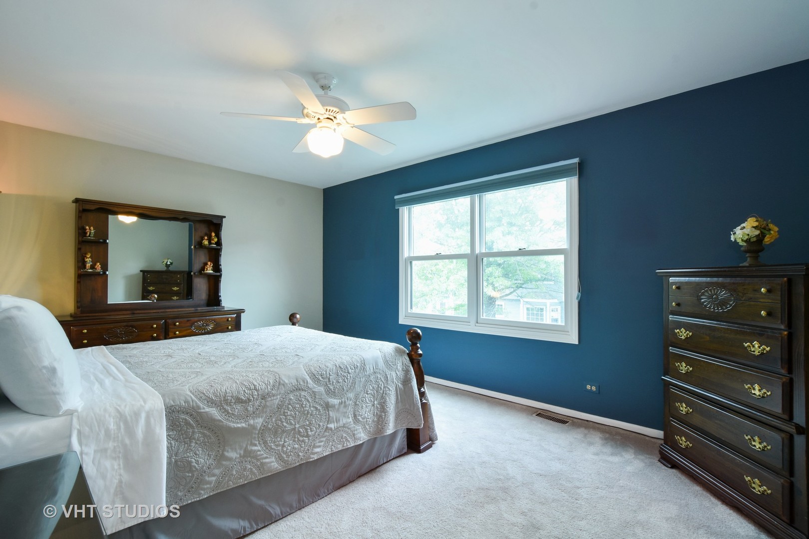 1320 Devonshire Road Buffalo Grove, IL 60089 - Photo 12 of 25 a bedroom with a bed and a dresser with mirror