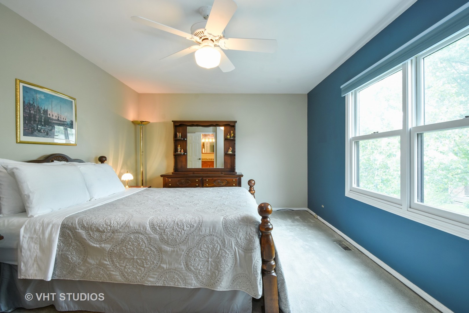1320 Devonshire Road Buffalo Grove, IL 60089 - Photo 13 of 25 a bedroom with a bed and a chandelier
