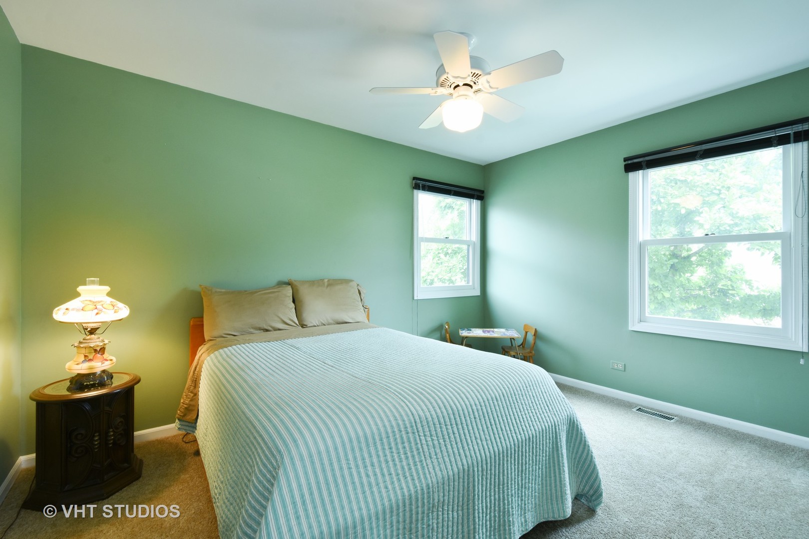 1320 Devonshire Road Buffalo Grove, IL 60089 - Photo 16 of 25 a bedroom with a bed and a chandelier