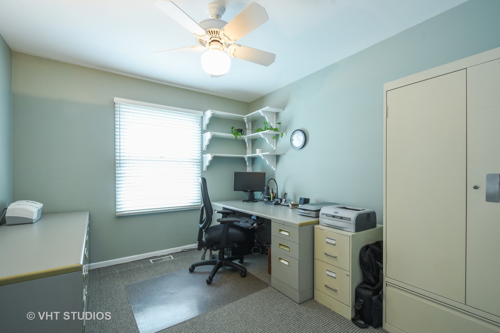 1320 Devonshire Road Buffalo Grove, IL 60089 - Photo 17 of 25 a view of a workspace with furniture and a window