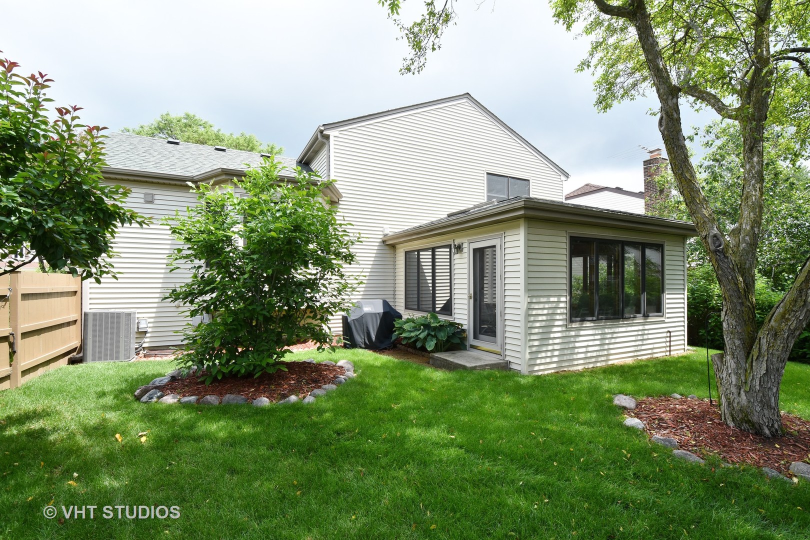 1320 Devonshire Road Buffalo Grove, IL 60089 - Photo 23 of 25 front view of a house with a yard