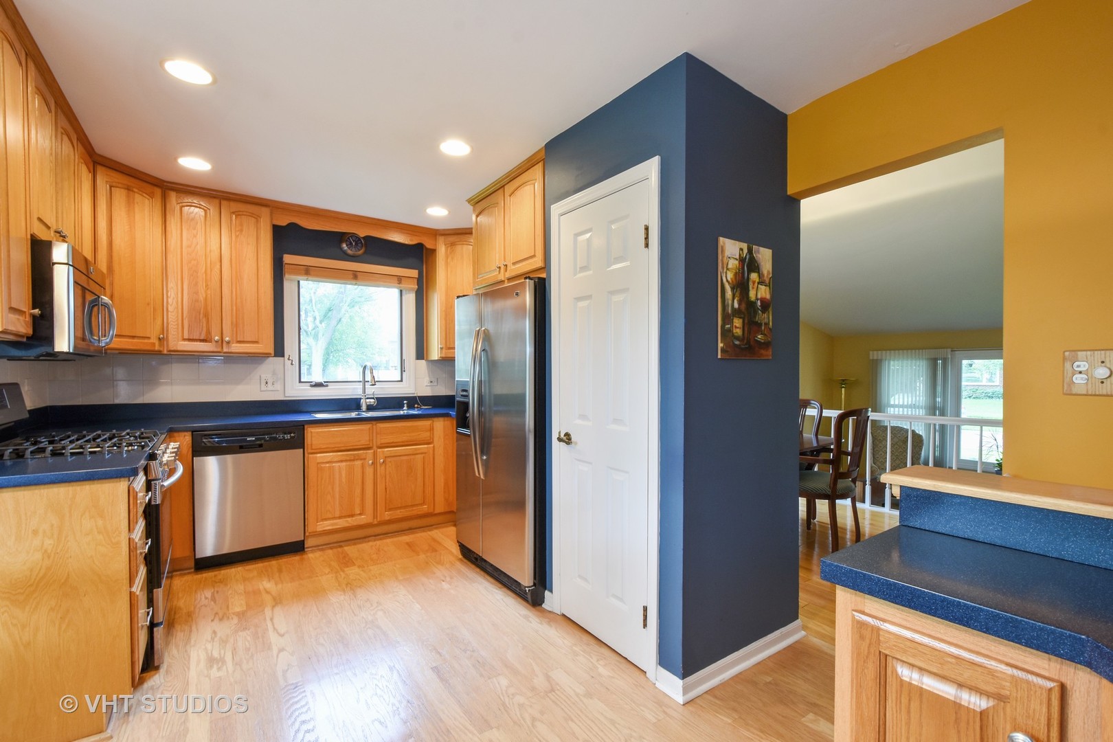 1320 Devonshire Road Buffalo Grove, IL 60089 - Photo 5 of 25 a kitchen with stainless steel appliances granite countertop a refrigerator and a sink
