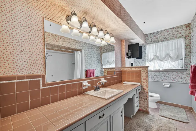 a bathroom with a bathtub and shower