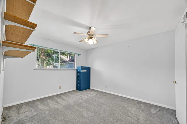 a view of workspace with ceiling fan