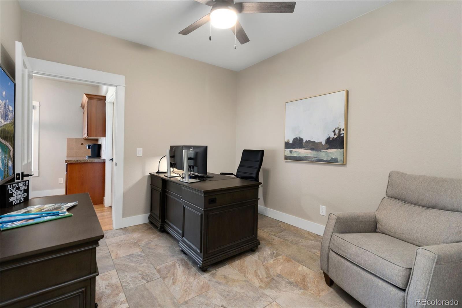 5475 Trade Wind Drive Windsor, CO 80528 - Photo 16 of 40 a view of a workspace with furniture