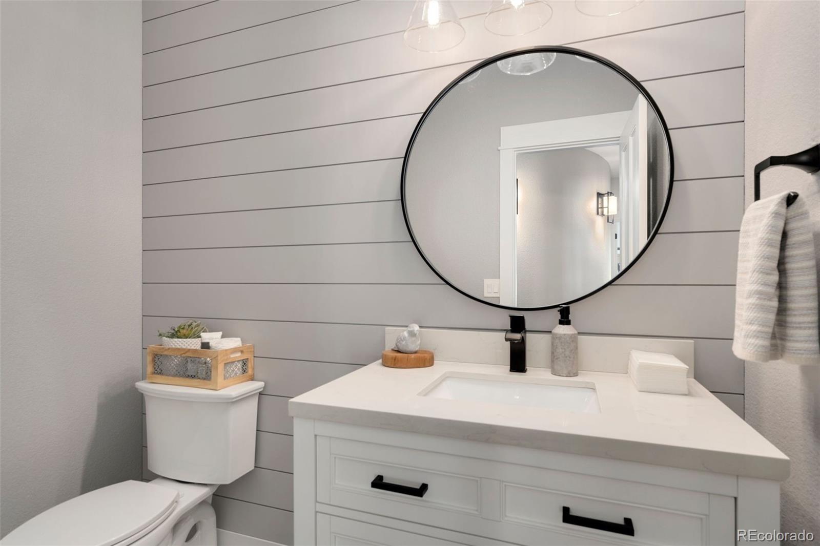 5475 Trade Wind Drive Windsor, CO 80528 - Photo 26 of 40 a bathroom with a sink mirror and toilet