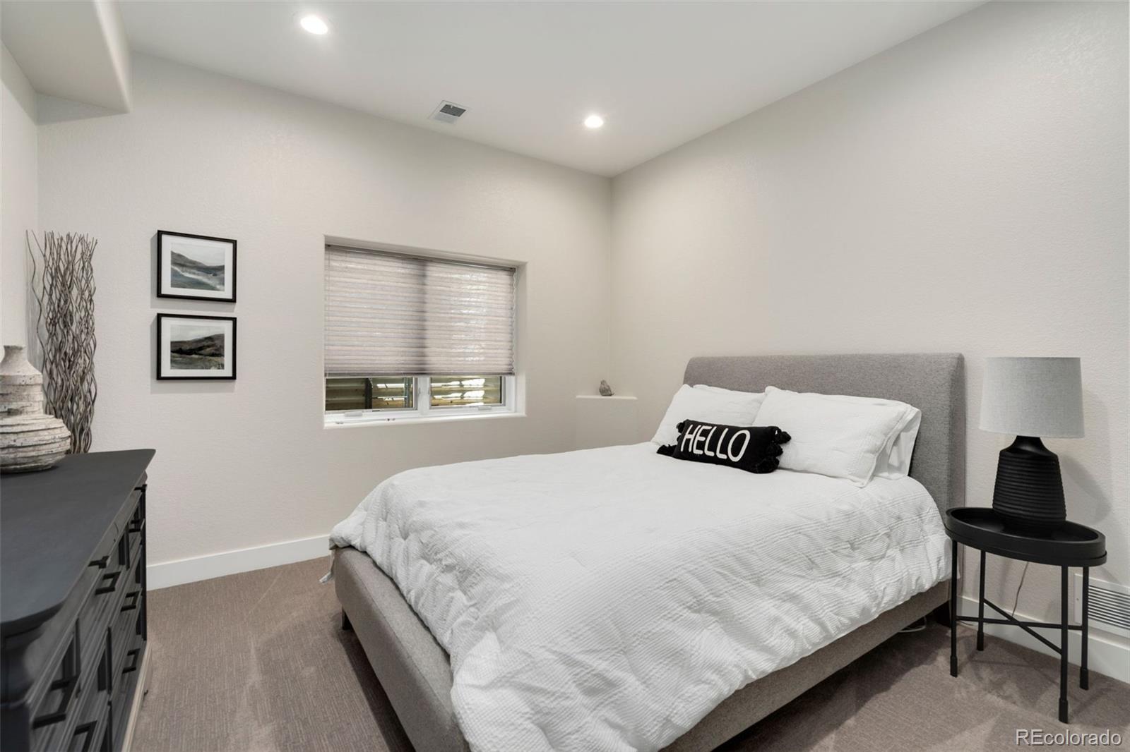 5475 Trade Wind Drive Windsor, CO 80528 - Photo 33 of 40 a bedroom with a bed and a window