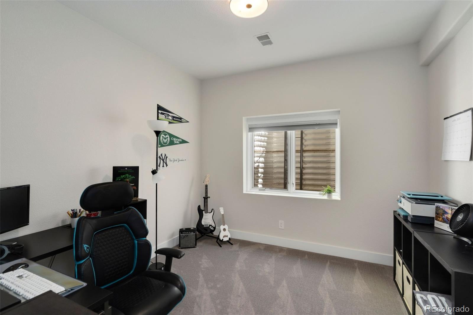 5475 Trade Wind Drive Windsor, CO 80528 - Photo 36 of 40 a view of a workspace with furniture and a window