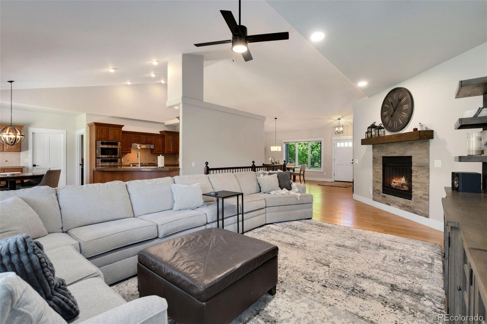 5475 Trade Wind Drive Windsor, CO 80528 - Photo 6 of 40 a living room with furniture and a fireplace