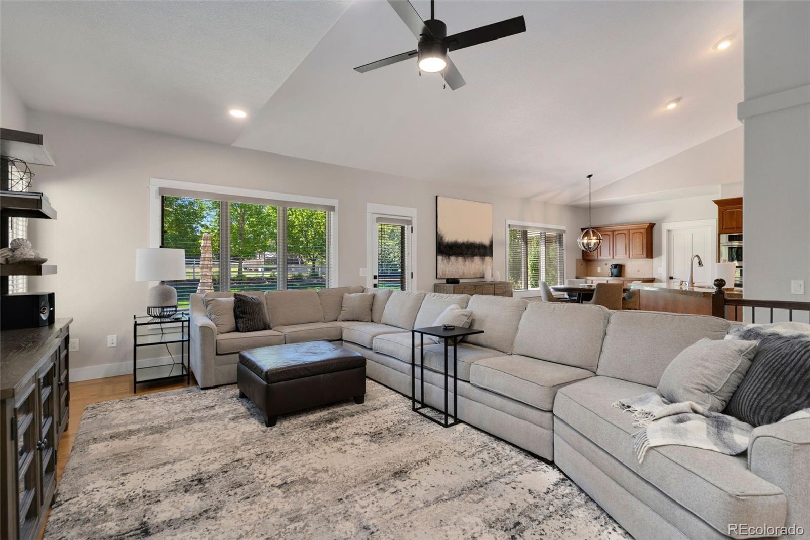 5475 Trade Wind Drive Windsor, CO 80528 - Photo 7 of 40 a living room with furniture and a large window