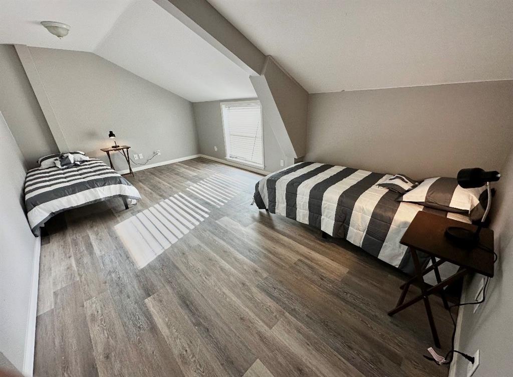 5205 Hudson Bend Road Austin, TX 78734 - Photo 21 of 21 a bedroom with a bed and wooden floor