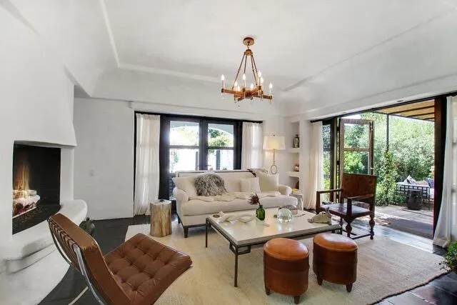 a living room with furniture and a table
