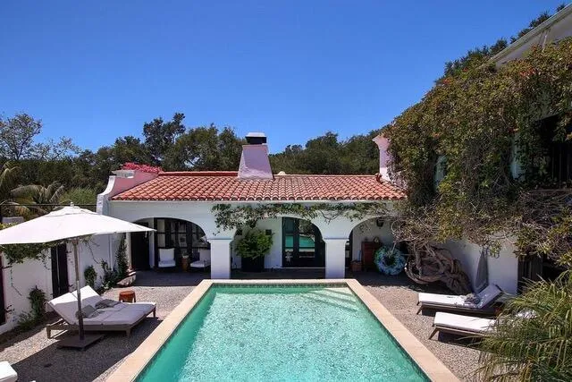 a view of a house with a yard porch and furniture