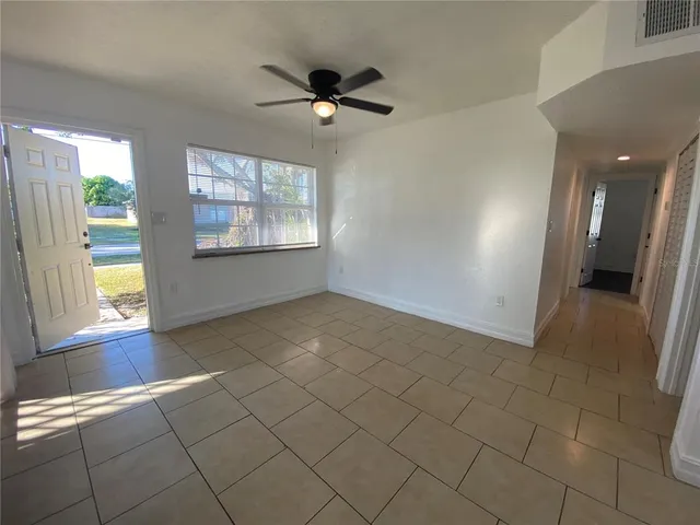 a view of an empty room with a window