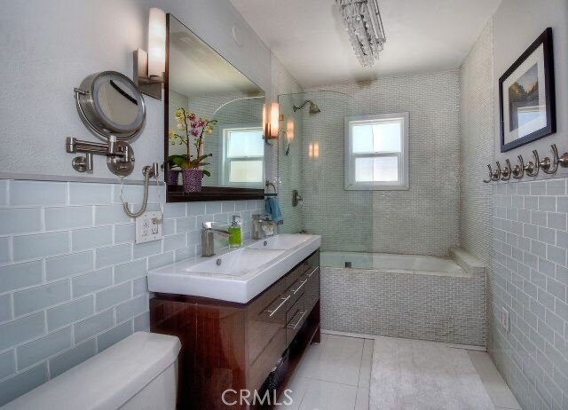 372 Jasmine Street Laguna Beach, CA 92651 - Photo 15 of 20 a bathroom with a sink a toilet and mirror