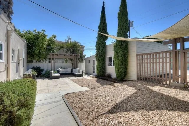 a view of a patio with couches and potted plants