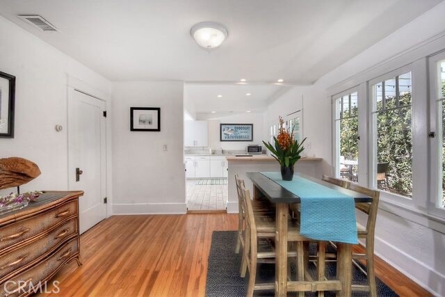372 Jasmine Street Laguna Beach, CA 92651 - Photo 8 of 20 a view of a dining room with furniture window and wooden floor