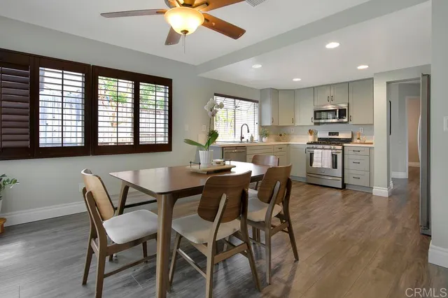 a view of a dining room with furniture window and wooden floor