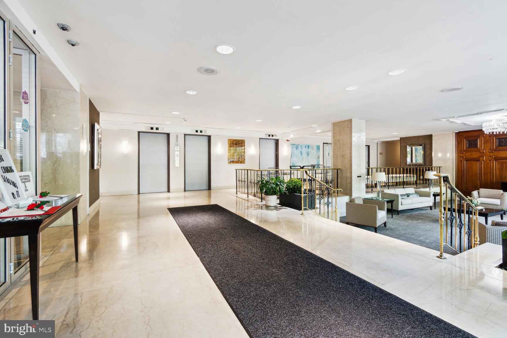 1900 Lyttonsville Road, Unit 702 Silver Spring, MD 20910 - Photo 12 of 20 a lobby with furniture and a potted plant