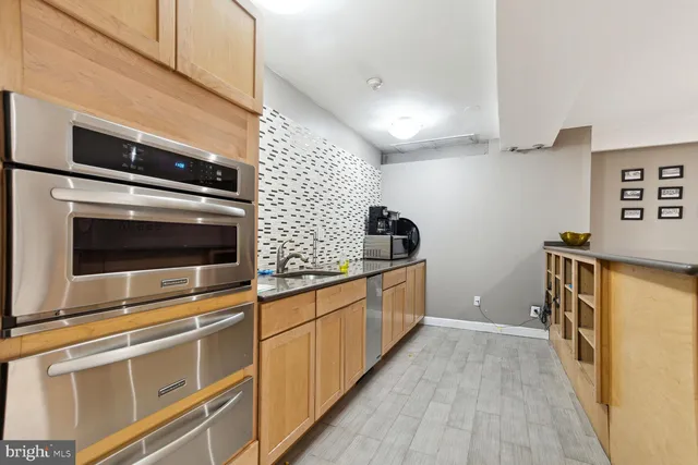 a kitchen with stainless steel appliances a stove and a refrigerator