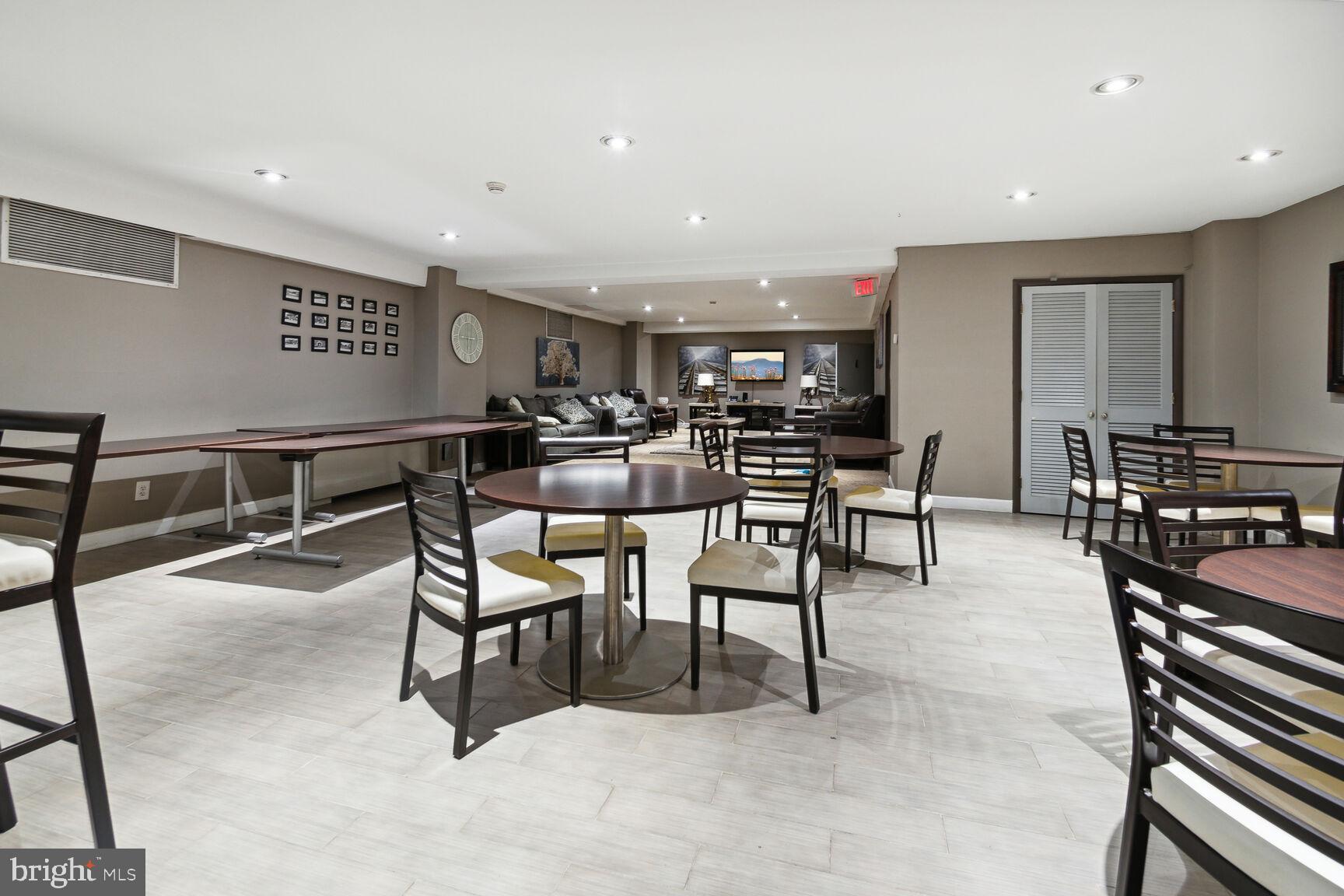 1900 Lyttonsville Road, Unit 702 Silver Spring, MD 20910 - Photo 17 of 20 a view of a dining room with furniture
