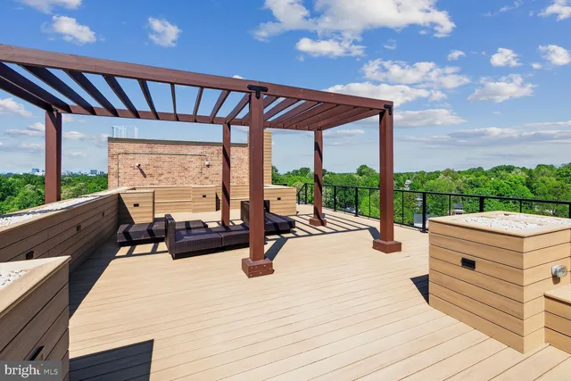 a view of swimming pool with outdoor seating
