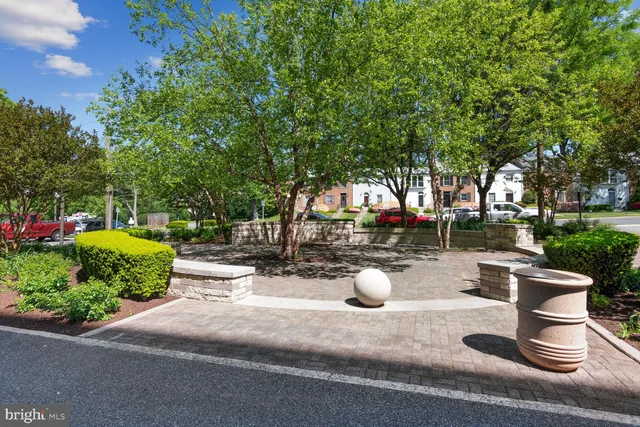 a view of a backyard with sitting area