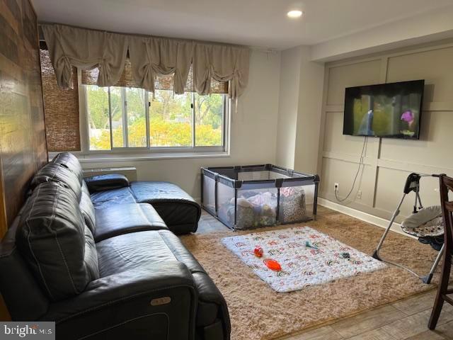 1900 Lyttonsville Road, Unit 702 Silver Spring, MD 20910 - Photo 6 of 20 a bedroom with a bed and a flat screen tv