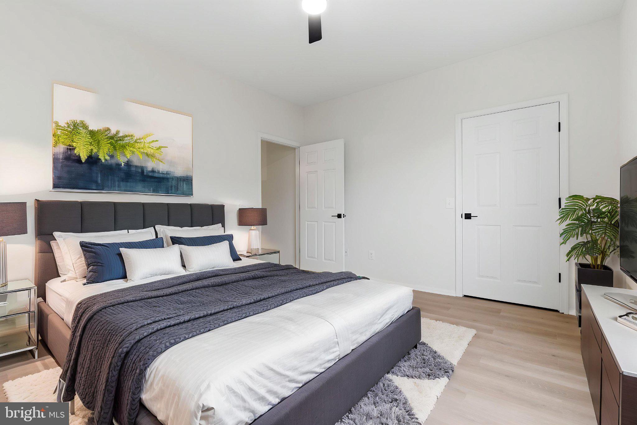1580 Spring Gate Dr., Unit 4303 McLean, VA 22102 - Photo 5 of 41 Serene bedroom with modern elegance.
