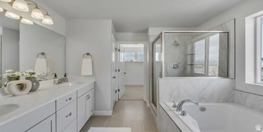 2184 West 2575th North, Unit 125 Clinton, UT 84015 - Photo 5 of 5 Bathroom featuring a double vanity with ample counter space, a large mirror, and overhead lighting