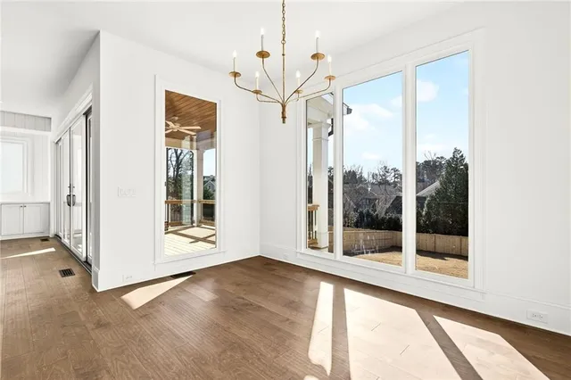 a view of a balcony with wooden floor