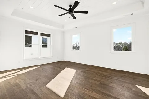 a spacious bathroom with a bathtub and a sink