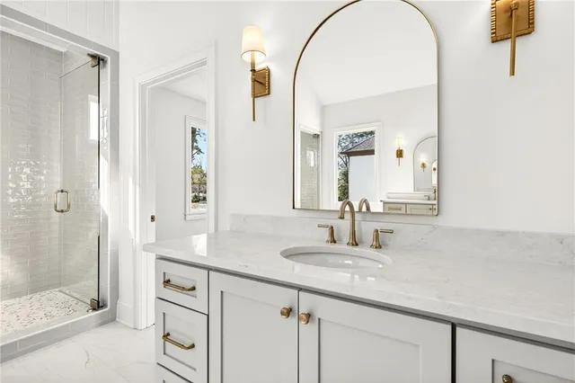 a spacious bathroom with a bathtub and a sink