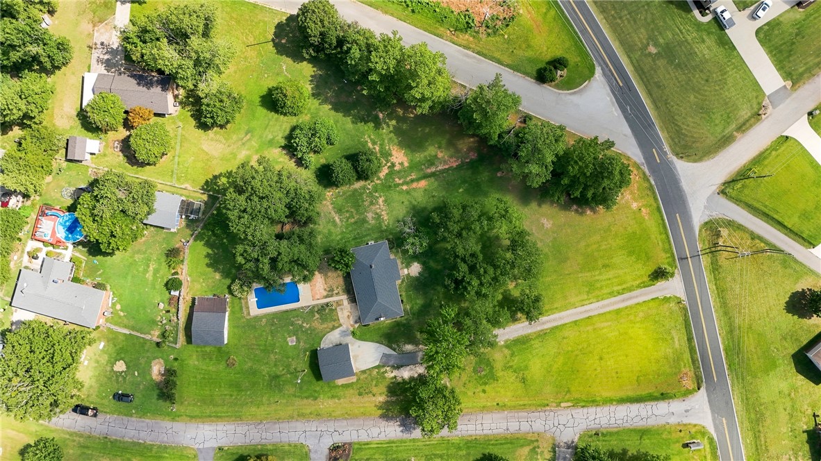 205 Timms Road Piedmont, SC 29673 - Photo 30 of 36 A spacious green parcel surrounds the home, bordered by mature trees and paved roadways.
