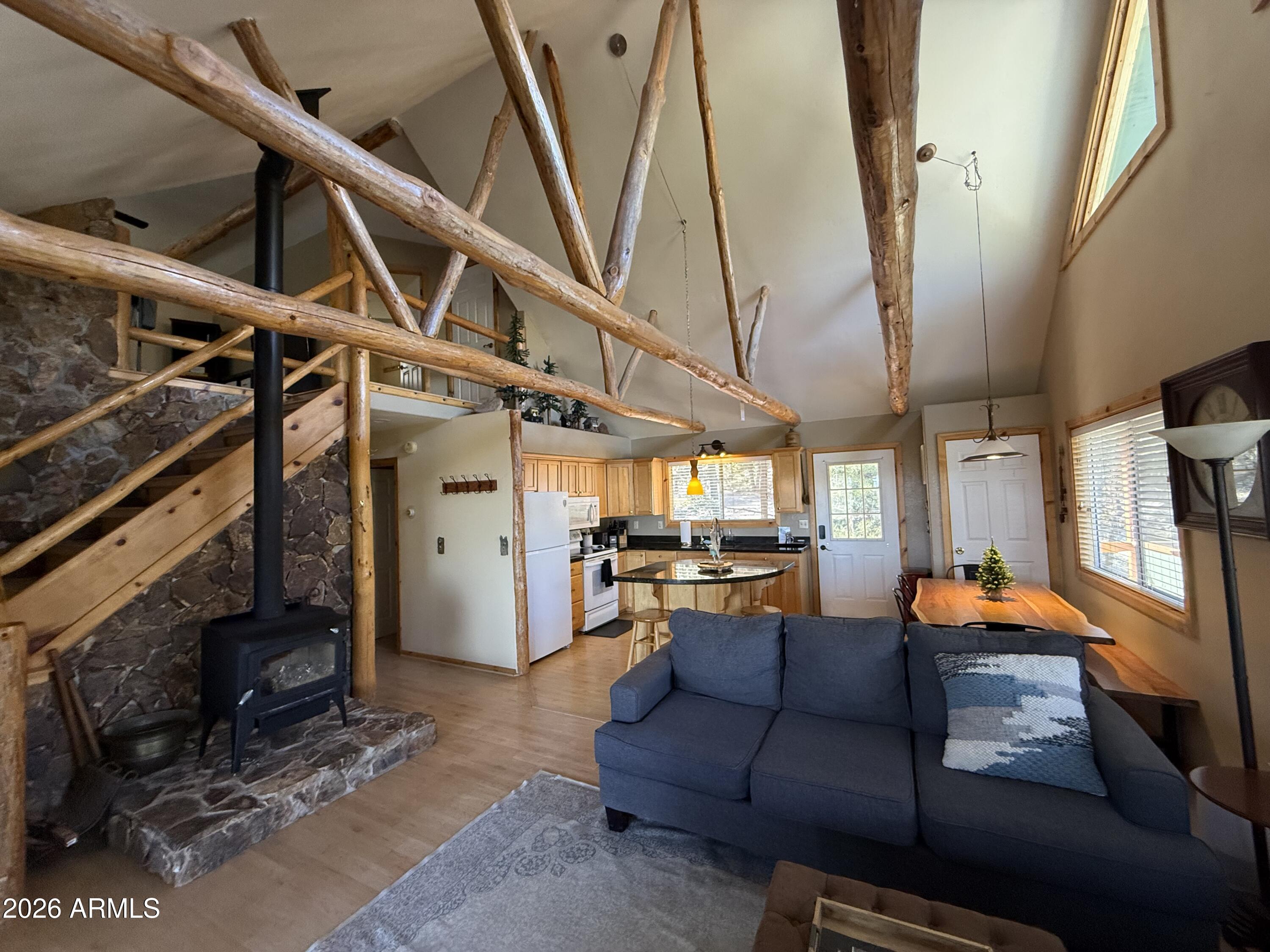 23487 Manzanita Road Crown King, AZ 86343 - Photo 13 of 41 a living room with patio furniture and a wooden floor