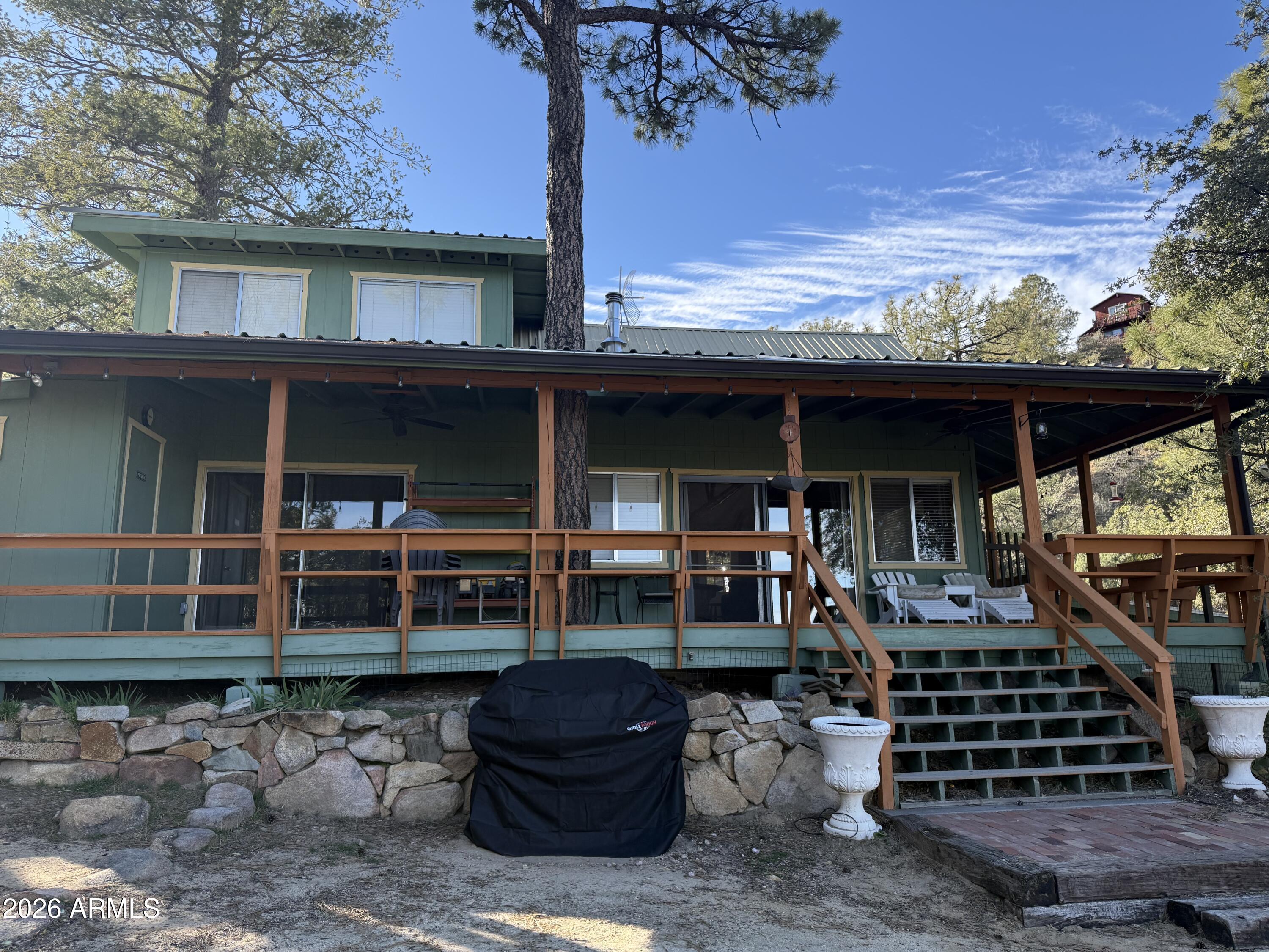 23487 Manzanita Road Crown King, AZ 86343 - Photo 21 of 45 a front view of a house with patio