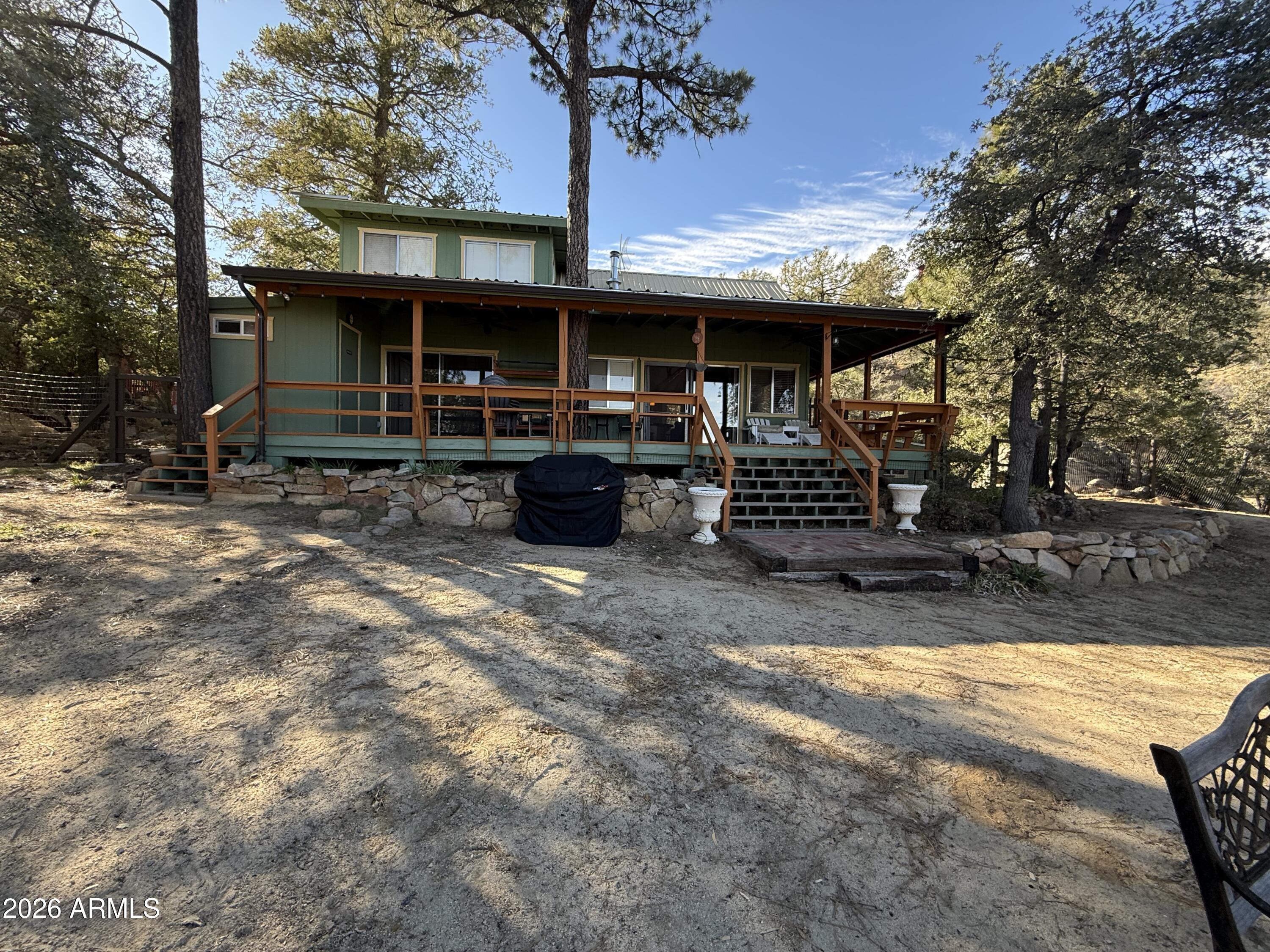 23487 Manzanita Road Crown King, AZ 86343 - Photo 22 of 41 a view of a house with backyard